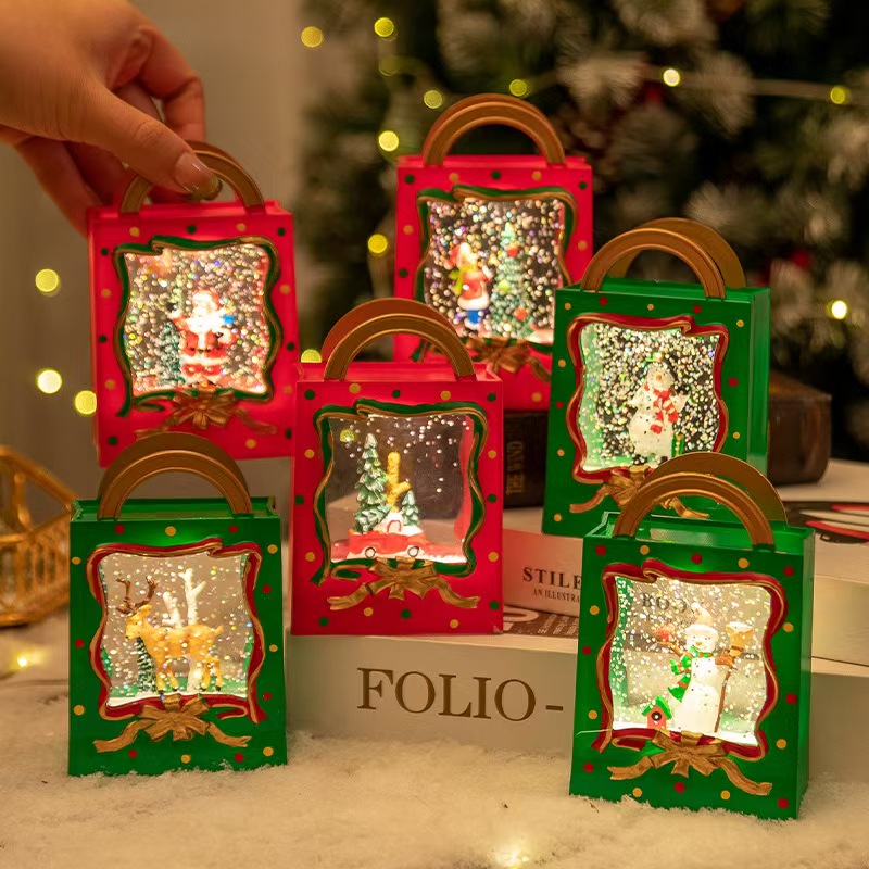 Luces nocturnas LED con diseños navideños sobre una mesa de noche